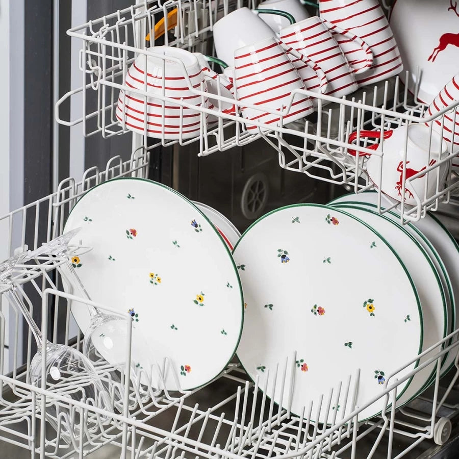 Hand-painted Gmundner Keramik arranged in a dishwasher