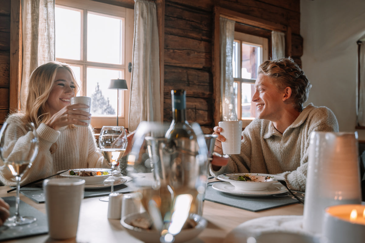 Hand-painted ceramics styled with natural textures in an alpine setting